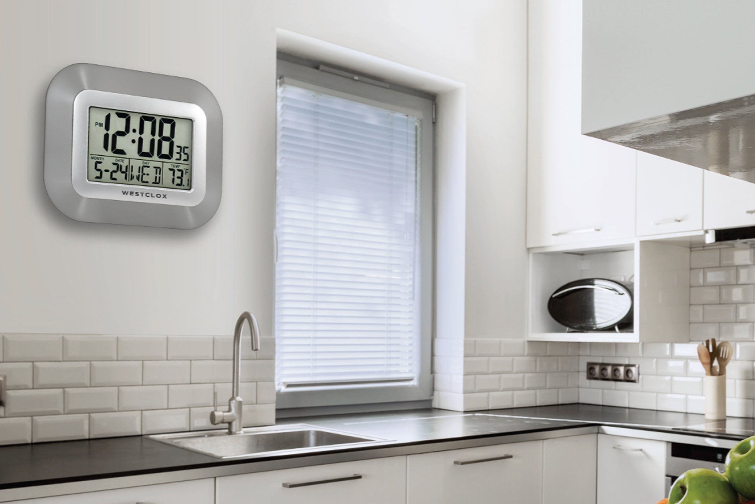 Digital clock on a kitchen wall