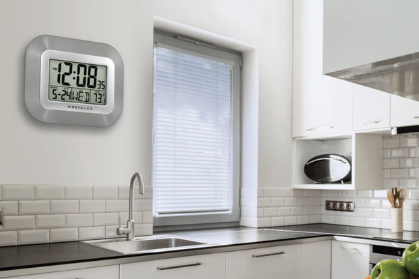 Digital clock on a kitchen wall