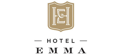 Logo of Hotel Emma with a shield-like emblem on a white background